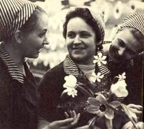 Lyuba Bezuglova (in the middle) is back from a trip to Moscow and has plenty to talk about